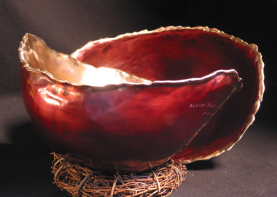 22. Deep red outside, high polish inside, opposite colors for bowl in back, light drip edge